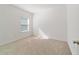 Well-lit bedroom with neutral walls and carpet at 7930 Sw 74Th Loop, Ocala, FL 34481