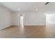 Large living room with hardwood floors and access to other rooms at 7930 Sw 74Th Loop, Ocala, FL 34481