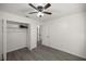 Bright bedroom with ceiling fan, closet and new flooring at 9554 Bahia Rd, Ocala, FL 34472