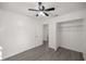 Bright bedroom with ceiling fan, new flooring, and spacious closet at 9554 Bahia Rd, Ocala, FL 34472