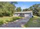 House exterior with a garage and driveway at 9554 Bahia Rd, Ocala, FL 34472