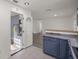 Kitchen with blue cabinets, wood countertop, and access to garage at 9554 Bahia Rd, Ocala, FL 34472