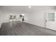 Bright living room with gray vinyl flooring and French doors at 9554 Bahia Rd, Ocala, FL 34472