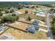 Aerial view showcasing house, yard, and neighborhood at 17 Locust Lane Ter, Ocala, FL 34472