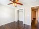 Bedroom with ceiling fan, hardwood floors and closet at 17 Locust Lane Ter, Ocala, FL 34472