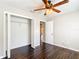 Bedroom with hardwood floors, ceiling fan and closet at 17 Locust Lane Ter, Ocala, FL 34472