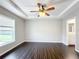 Bright bedroom with hardwood floors and ceiling fan at 17 Locust Lane Ter, Ocala, FL 34472