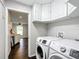 Laundry room with Samsung washer and dryer and cabinets at 17 Locust Lane Ter, Ocala, FL 34472