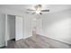 Bedroom with double door closet and vinyl plank flooring at 175 Fisher Way Trl, Ocklawaha, FL 32179