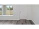 Interior entryway with grey flooring, white door, and window at 175 Fisher Way Trl, Ocklawaha, FL 32179