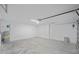 Garage with automatic door opener and concrete floor at 175 Fisher Way Trl, Ocklawaha, FL 32179