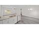 Open concept kitchen with granite countertops and stainless steel appliances at 175 Fisher Way Trl, Ocklawaha, FL 32179