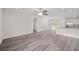 Open floor plan with grey flooring, kitchen, and access to other rooms at 175 Fisher Way Trl, Ocklawaha, FL 32179