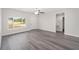 Spacious living area with vinyl flooring, a ceiling fan, and an open floor plan at 175 Fisher Way Trl, Ocklawaha, FL 32179