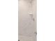 Clean shower with marble-look tile and chrome fixtures at 175 Fisher Way Trl, Ocklawaha, FL 32179