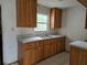 Kitchen with wood cabinets and double sink at 2103 Parkview Ave, Leesburg, FL 34748