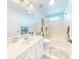 Clean bathroom with a shower/tub combo and white vanity at 27018 Nature View St, Leesburg, FL 34748