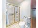 Bathroom with shower, toilet, and linen storage at 27018 Nature View St, Leesburg, FL 34748