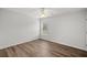 Well-lit bedroom featuring wood-look floors and a window at 30 Maple Crse, Ocklawaha, FL 32179