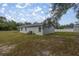 Rear view of the house showcasing a fenced yard at 30 Maple Crse, Ocklawaha, FL 32179
