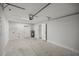 Garage with concrete floor, water heater, and storage at 30 Maple Crse, Ocklawaha, FL 32179