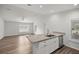 Kitchen island and stainless steel appliances at 30 Maple Crse, Ocklawaha, FL 32179