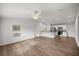 Open living room and kitchen with wood-look flooring at 30 Maple Crse, Ocklawaha, FL 32179