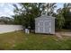 Gray storage shed in the backyard at 30 Maple Crse, Ocklawaha, FL 32179