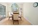 Bright dining area with wood table and four chairs and backyard view at 5336 Sw 109Th Place Rd, Ocala, FL 34476