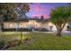Charming single-story home with landscaped yard and lovely sunset at 5336 Sw 109Th Place Rd, Ocala, FL 34476