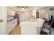 Bright kitchen features white appliances and a breakfast bar at 5336 Sw 109Th Place Rd, Ocala, FL 34476