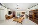 Comfortable living room featuring a leather couch and wood furniture at 5336 Sw 109Th Place Rd, Ocala, FL 34476