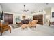 Spacious living room with leather sofa and built-in wooden shelving at 5336 Sw 109Th Place Rd, Ocala, FL 34476