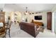 Living room showcasing a leather sofa and high ceilings at 5336 Sw 109Th Place Rd, Ocala, FL 34476