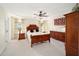 Spacious main bedroom with wood furniture and ceiling fan at 5336 Sw 109Th Place Rd, Ocala, FL 34476