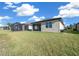 Spacious backyard with extended patio and screened enclosure at 6119 Sw 93Rd Cir, Ocala, FL 34481