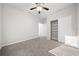 Spacious bedroom with a large closet and carpet at 6119 Sw 93Rd Cir, Ocala, FL 34481