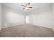 Spacious bedroom with plush carpet and an ensuite bathroom at 6119 Sw 93Rd Cir, Ocala, FL 34481