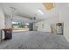 Attached garage with open door, showing a view of the community at 6119 Sw 93Rd Cir, Ocala, FL 34481
