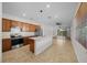 Open concept kitchen with island and stainless steel appliances at 6119 Sw 93Rd Cir, Ocala, FL 34481