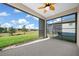 Screened lanai overlooking a backyard and community at 6119 Sw 93Rd Cir, Ocala, FL 34481