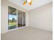 Covered lanai with sliding glass doors leading to backyard at 6119 Sw 93Rd Cir, Ocala, FL 34481