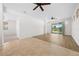Spacious living area with hardwood floors and view to backyard at 6119 Sw 93Rd Cir, Ocala, FL 34481