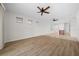 Spacious living area with hardwood flooring and ceiling fan at 6119 Sw 93Rd Cir, Ocala, FL 34481
