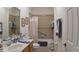 Clean bathroom with a tub, shower, and updated vanity at 8616 Sw 82Nd Ter, Ocala, FL 34481