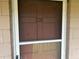 Condo entrance with screen door and number 216 at 1100 E Caroline St # 216, Tavares, FL 32778