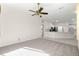 Bright living room with carpet flooring and a view of the kitchen at 2350 Nw 59Th Ave, Ocala, FL 34482