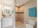 Clean bathroom with a walk-in shower and granite vanity at 28 Juniper Pass Dr, Ocala, FL 34480