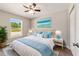 Second bedroom with a queen-size bed, creating a relaxing atmosphere at 28 Juniper Pass Dr, Ocala, FL 34480