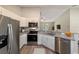 Modern kitchen with stainless steel appliances and granite countertops at 28 Juniper Pass Dr, Ocala, FL 34480